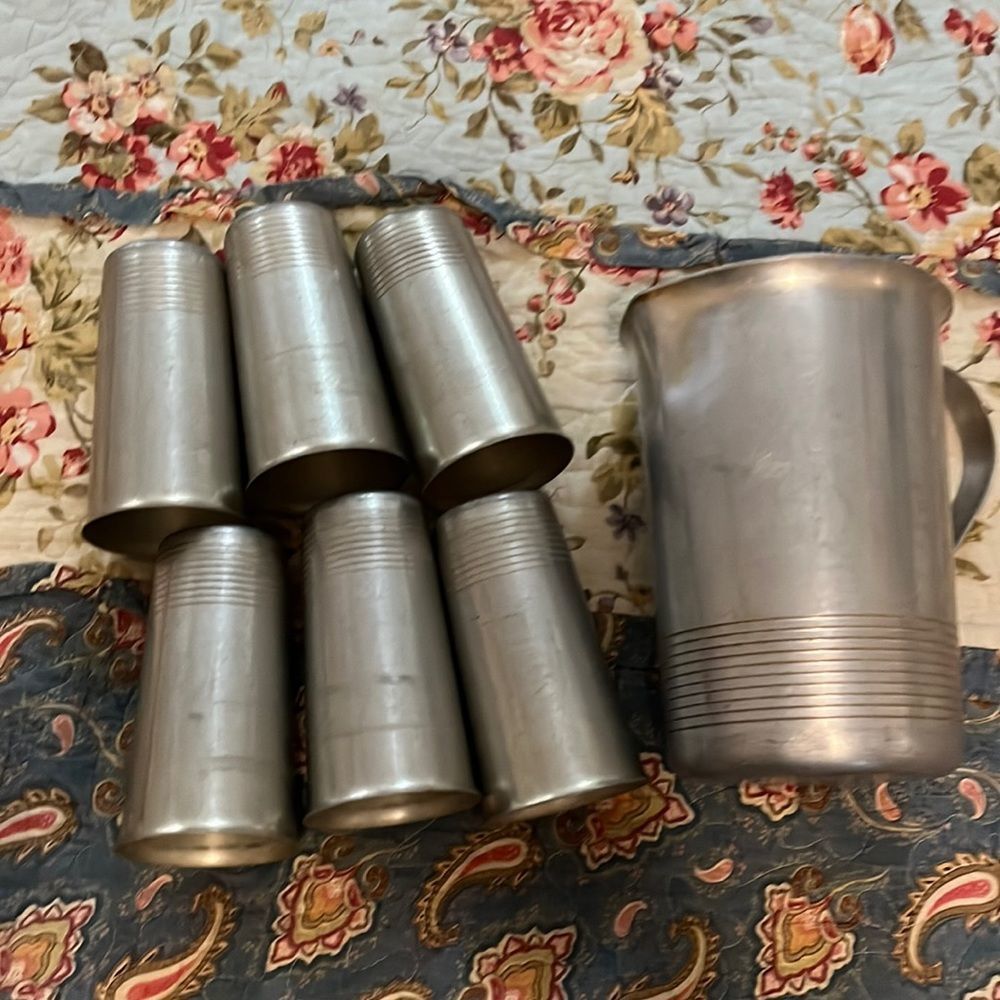 Antique metal cups and pitcher
